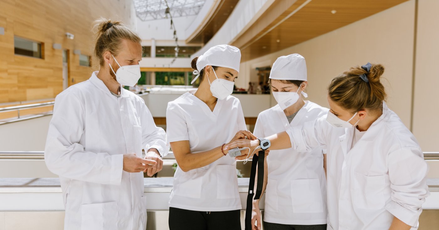 Clinician and patient reviewing Aidmed readings during the COVID-19 research study