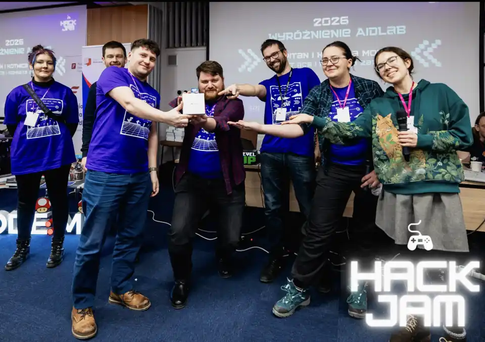 The Aidlab award presentation at HackJam 2026 in Gdańsk, with participants holding an Aidlab box
